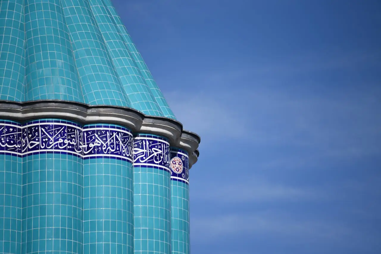 services-img Close-up of the iconic turquoise dome at Mevlana Museum against a clear blue sky.